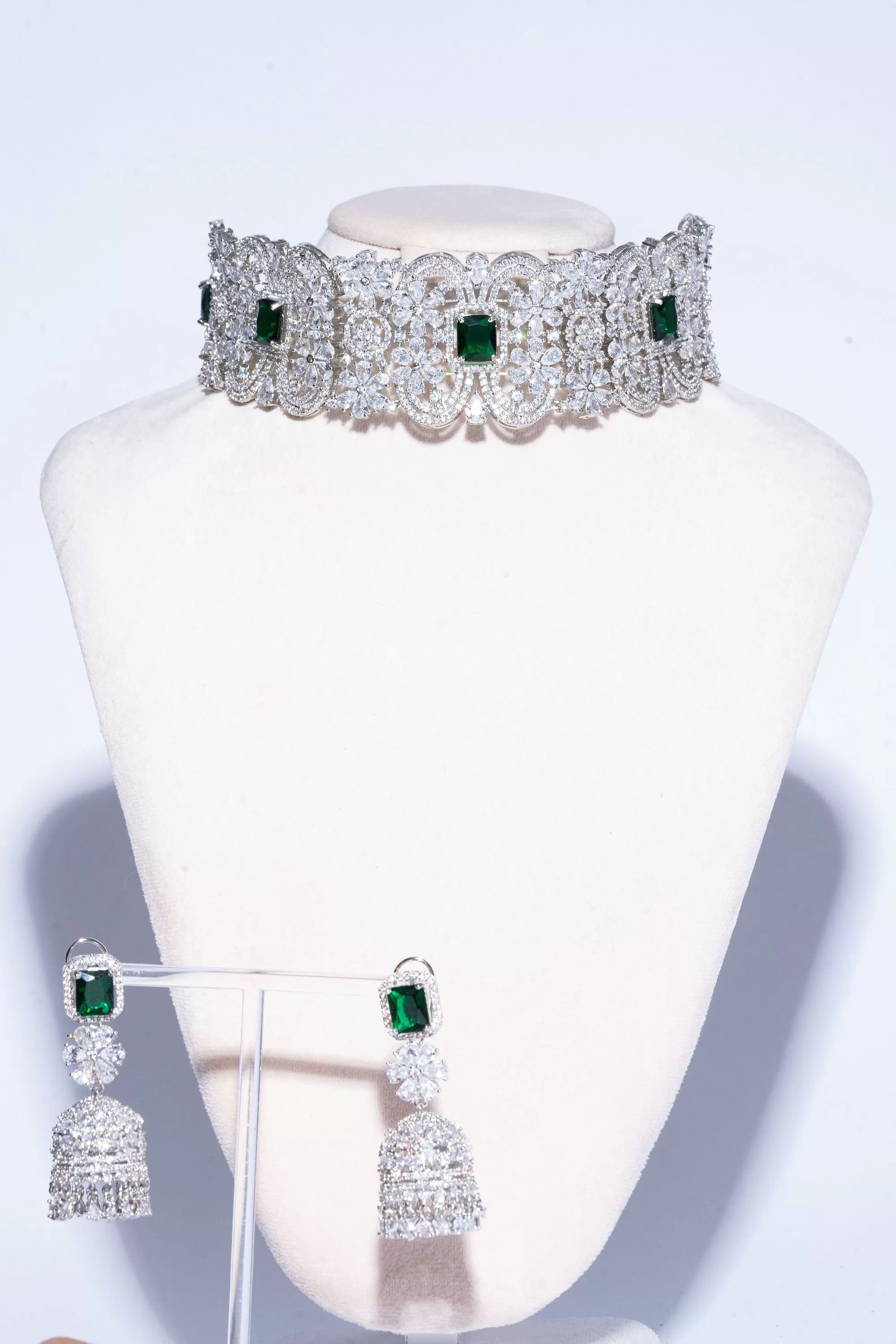 Cerise White Gold and Emerald Choker and Jhumka Earring Set By Jaipur Rose Designer Modern Indian Jewelry