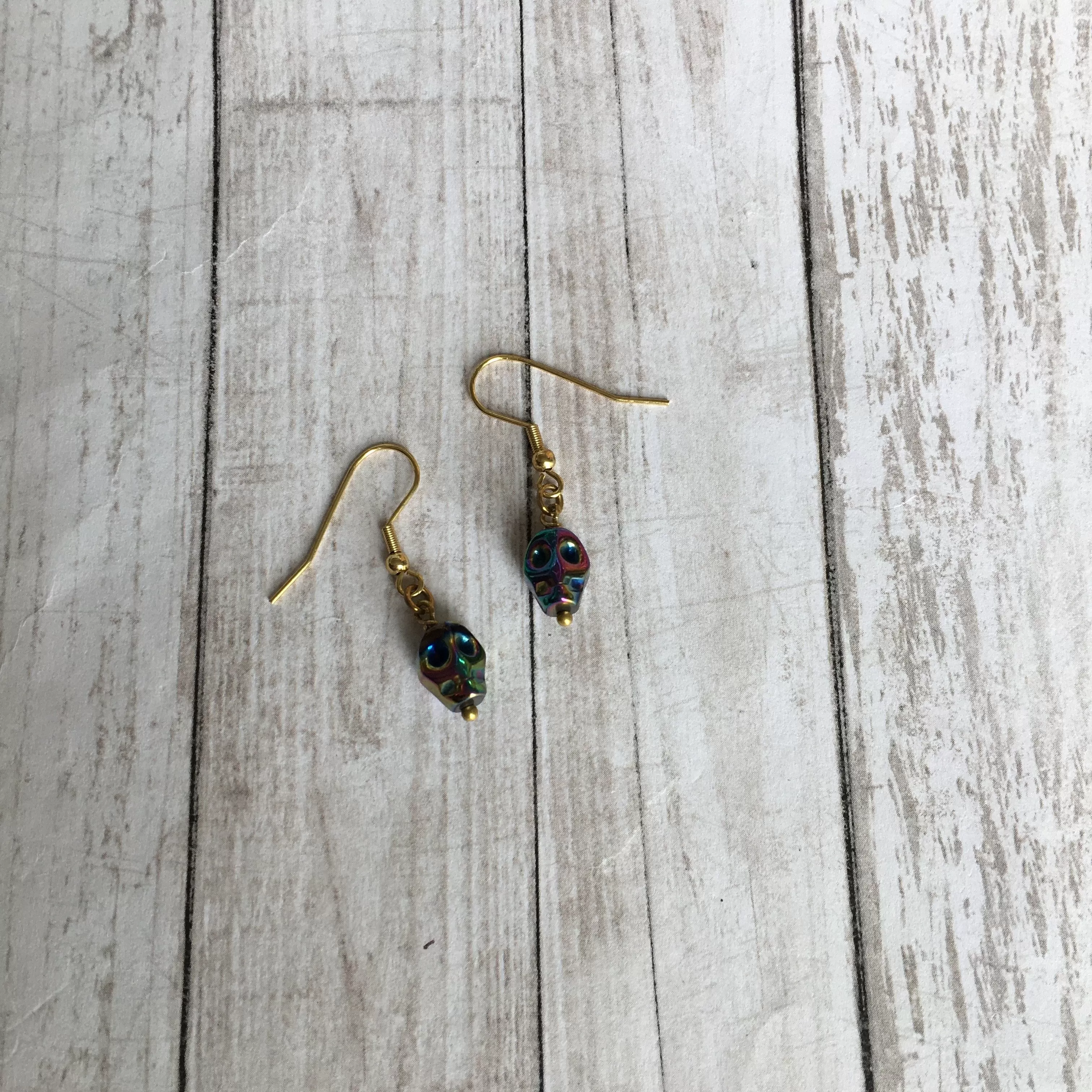 The Rainbow Hematite Skull Earrings